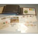 A box of miscellaneous loose stamps together with various first day covers dating from the 1970s