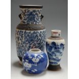 An early 20th century Japanese crackle glaze blue and white vase, of baluster form, having bronzed