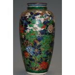 A Japanese Taisho period vase, of baluster form, having all-over incised and enamelled floral