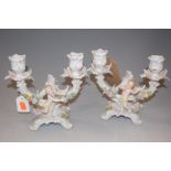 A pair of early 20th century Sitzendorf porcelain twin sconce figural floral encrusted candelabra