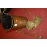 A copper coal scuttle, various turned brass fire tools, and a brass chestnut roaster