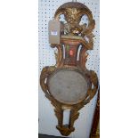 A 19th century French carved giltwood barometer (lacking dials)