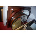 An Edwardian inlaid mahogany oval wall mirror; and three other various mirrors (4)