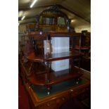 A mid Victorian mahogany mirrorback three tier whatnot, width 106cm