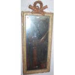 A mid 19th century gilt wood framed marginal wall mirror, having carved laurel wreath surmount,