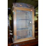 A pine glazed hanging wall cabinet, width 48cm