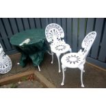 A Victorian style white painted pierced metal garden suite comprising circular table and four chairs