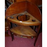 An early 19th century mahogany bowfront two-tier corner wash stand, width 68cm