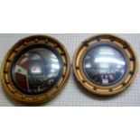 Two Regency style circular convex gilt framed wall mirrors