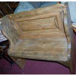 A stained pine two seater pew, width 94cm