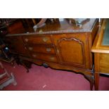 A figured walnut sideboard, width 140cm