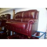 A contemporary chestnut brown leather lounge suite comprising pair of two seater sofas, three