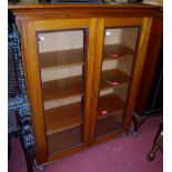 An Edwardian walnut bookcase, width 109cm
