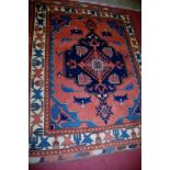 A Turkish red ground woollen rug having Kelim ends, 182x148cm