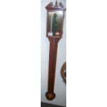 A reproduction mahogany stick barometer with brass dial