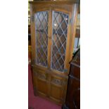 A contemporary Old Charm moulded oak corner cupboard, width 68.5cm