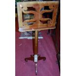 A reproduction cherrywood music stand