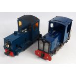 A pair of 32mm garden scale 0-4-0 electric battery operated shunter style locos, both finished in