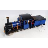 A Cheddar Models of Somerset 32mm gauge 1 0-4-0 gas fired locomotive and tender finished in blue and