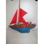 A kitbuilt/scratchbuilt sailing yacht named Diomeds, finished in red and blue with stained upper