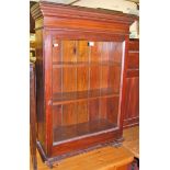 A 19th century stained pine single door glazed bookcase, w.68cm