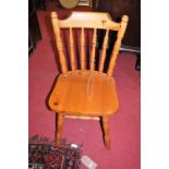 A set of four modern pine stickback kitchen chairs