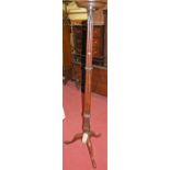 An early 20th century mahogany pedestal plant-stand, having a cluster column, h.173cm