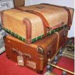 A faux wicker and leather capped suitcase; and a metal bound trunk (2)