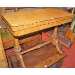 A mid-Victorian oak round cornered fold-over card table, raised on reeded and bulbous end