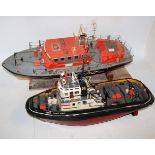 Two scratchbuilt/kitbuit radio controlled boats to include an RNLI lifeboat, together with a Smit