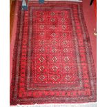 A Persian woollen red ground Bokhara prayer rug, 120 x 82cm; and one other red ground Bokhara rug,