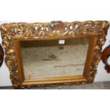 A floral gilt framed rectangular wall mirror; together with a Regency style circular convex wall