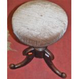 An early Victorian mahogany and upholstered swivel music stool