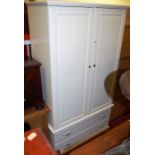 A contemporary white wood double door wardrobe having twin long lower drawers, width 109cm