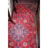 A Persian woollen red ground Tabriz rug, 320 x 208cm