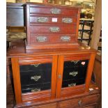 An Edwardian walnut table top cupboard fitted with three long drawers, width 58.5cm, together with a