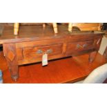 An Indonesian teak low two drawer coffee table, length 120cm