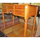 A Victorian mahogany five drawer side table, having sunburst kneehole design and raised on turned