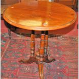 An Aesthetic Movement walnut circular fixed top tripod occasional table, dia. 61cm