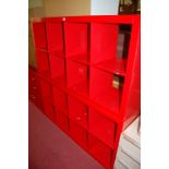 A pair of contemporary red lacquered modular wall units, together with a matching low side chest (