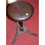 A Victorian cast iron and leather studded topped workman's stool