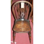 A set of four early 20th century elm seat and beech wheelback kitchen chairs