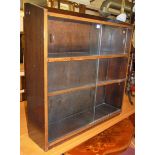 A mid-20th century oak bookshelf, having four glazed sliding doors; together with a reproduction