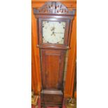 A circa 1800 provincial oak longcase clock, having a painted dial, thirty hour movement, with