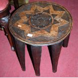 An early 20th century African hardwood circular eight legged nupe stool, dia. 44cm