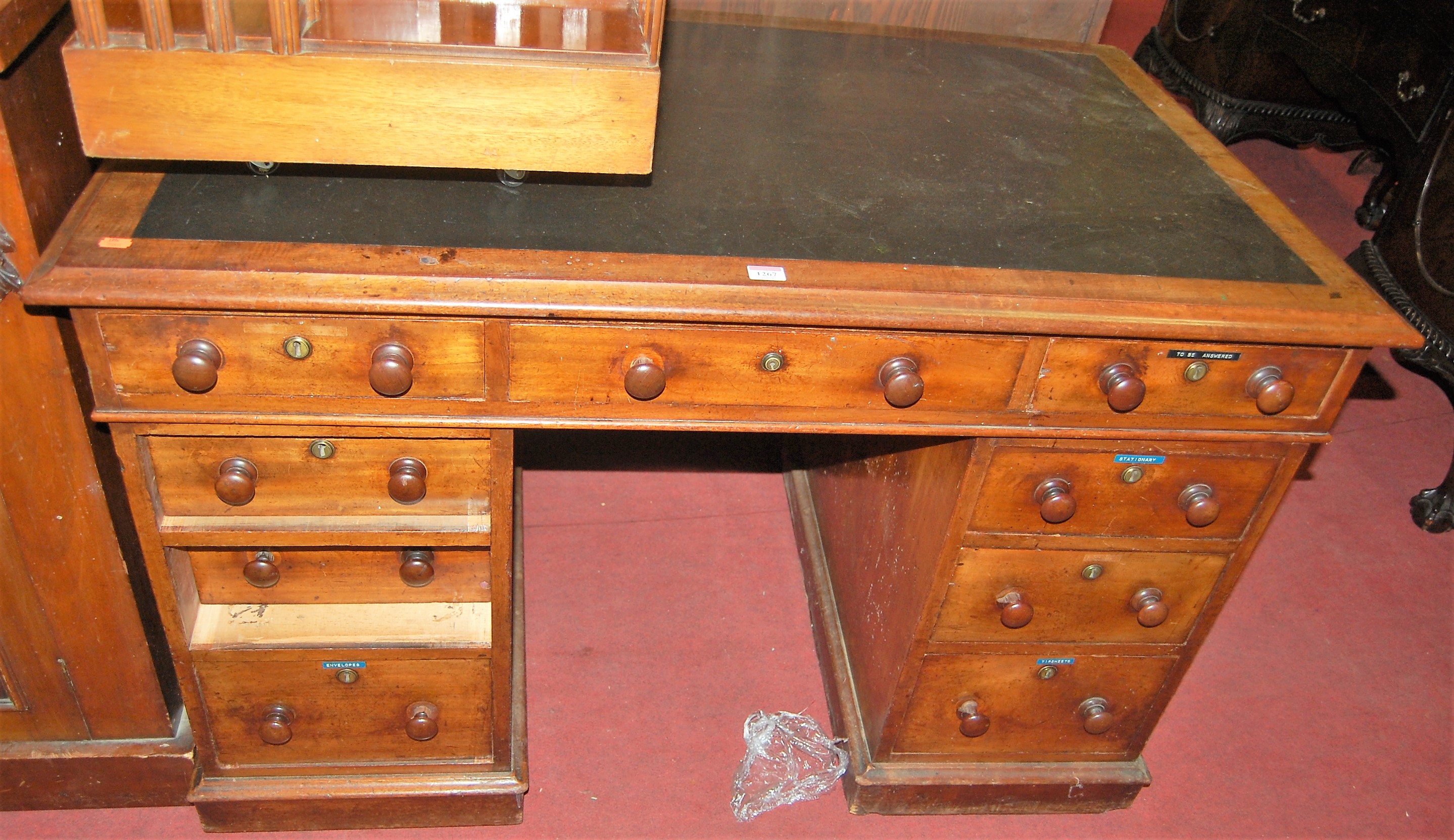 A Victorian mahogany and leather inset twin pedestal writing desk, w.122cm
