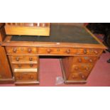 A Victorian mahogany and leather inset twin pedestal writing desk, w.122cm