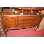 A figured walnut sideboard, width 140cm