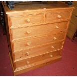 A modern pine squarefront chest of two short over four long drawers, width 102cm