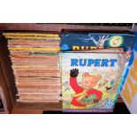 Two boxes containing a quantity of Rupert and Ladybird books